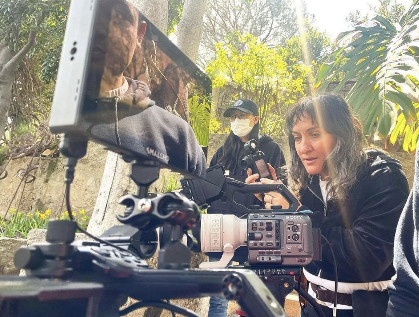 Tamar Halpern in front of a camera monitor